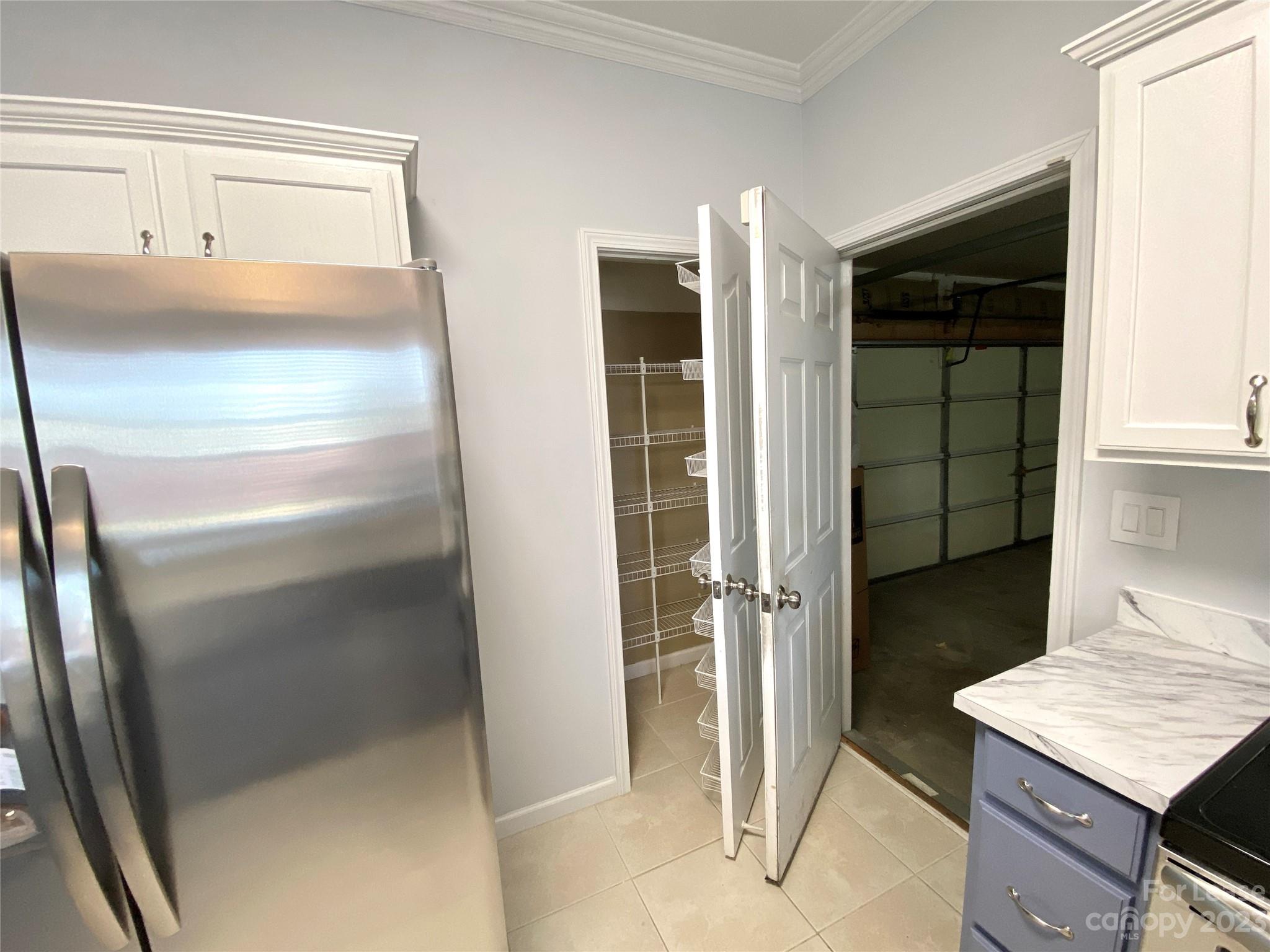 161 Mott Road Mooresville, NC 28115 - Photo 13 of 27 a room with cabinets and a refrigerator