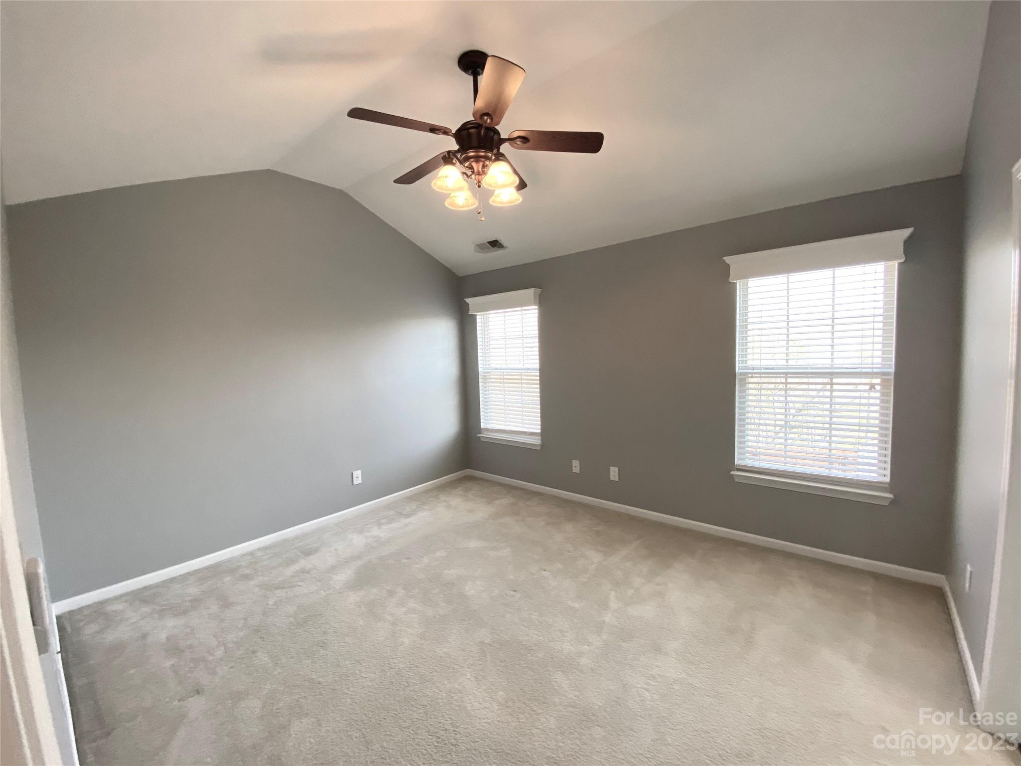 161 Mott Road Mooresville, NC 28115 - Photo 15 of 27 an empty room with a window and a fan