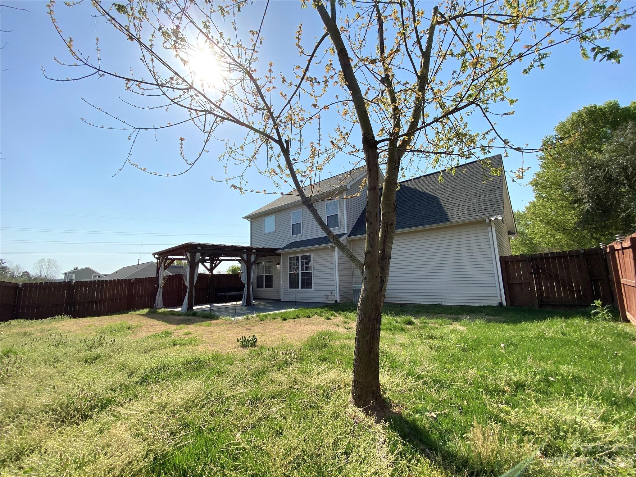 161 Mott Road Mooresville, NC 28115 - Photo 25 of 27 a view of a house with a yard and large tree