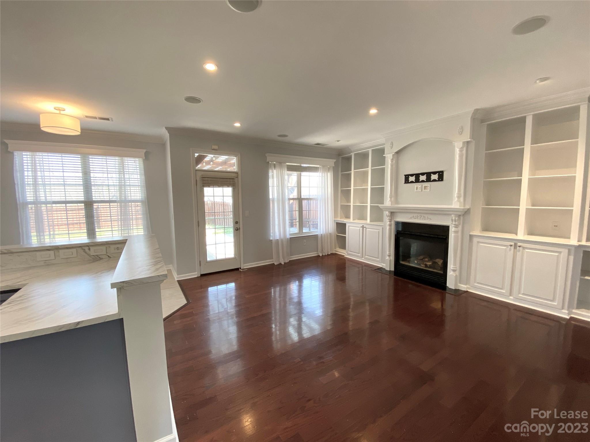 161 Mott Road Mooresville, NC 28115 - Photo 3 of 27 a view of an empty room with wooden floor and a window