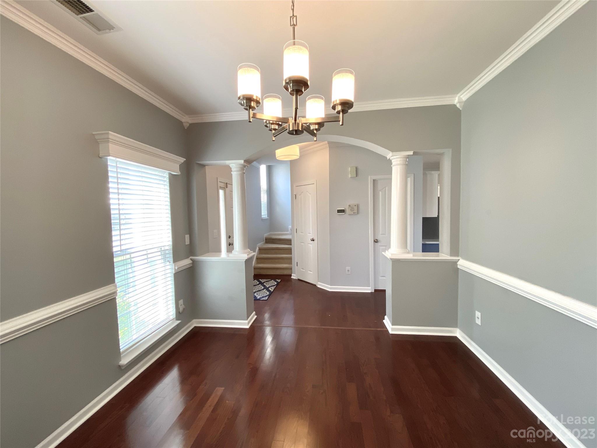 161 Mott Road Mooresville, NC 28115 - Photo 5 of 27 a view of an empty room with wooden floor and a window