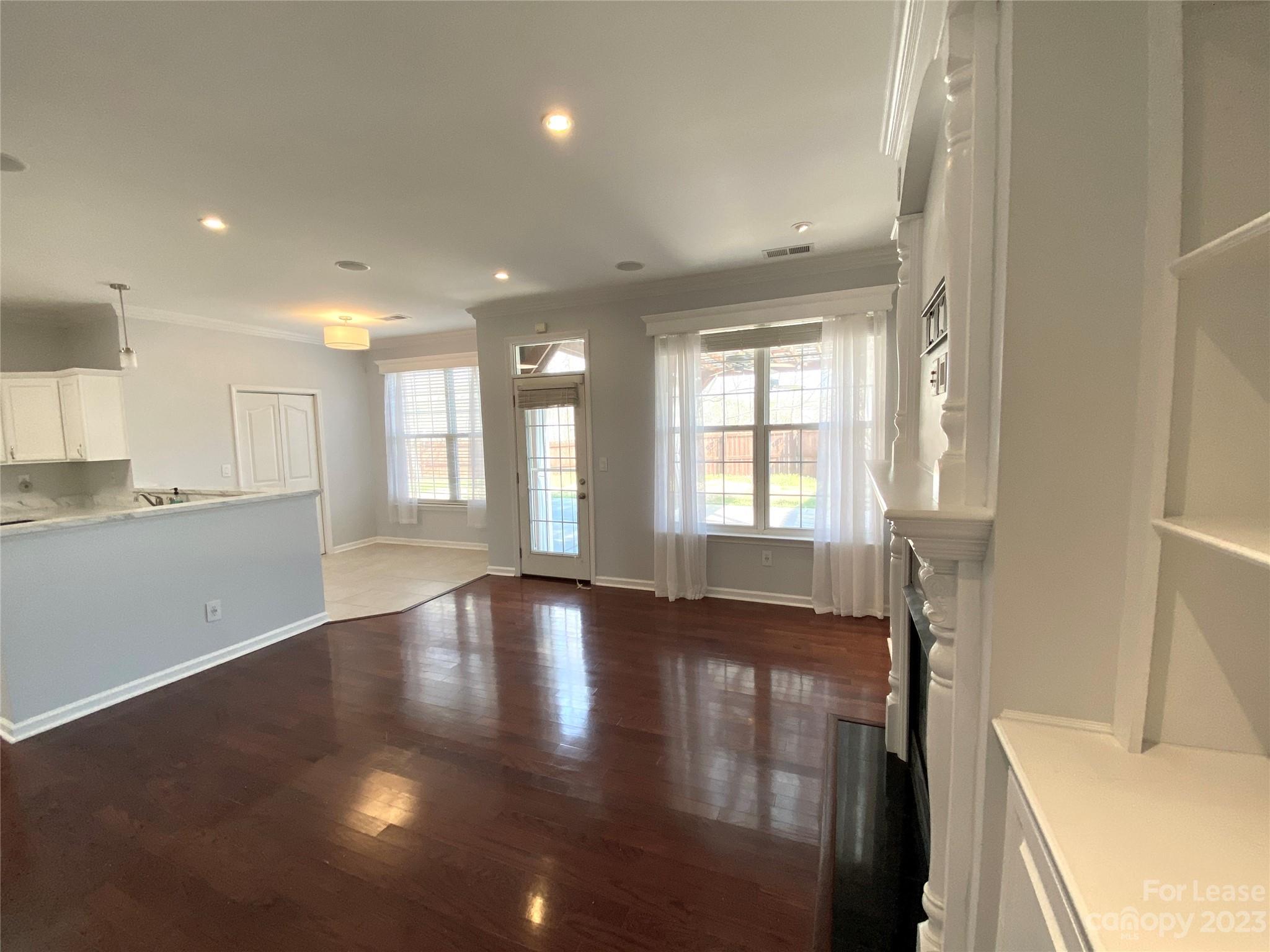 161 Mott Road Mooresville, NC 28115 - Photo 9 of 27 a view of an empty room with wooden floor and a window