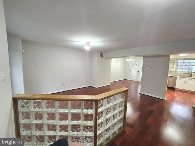 a view of bedroom with wooden floor