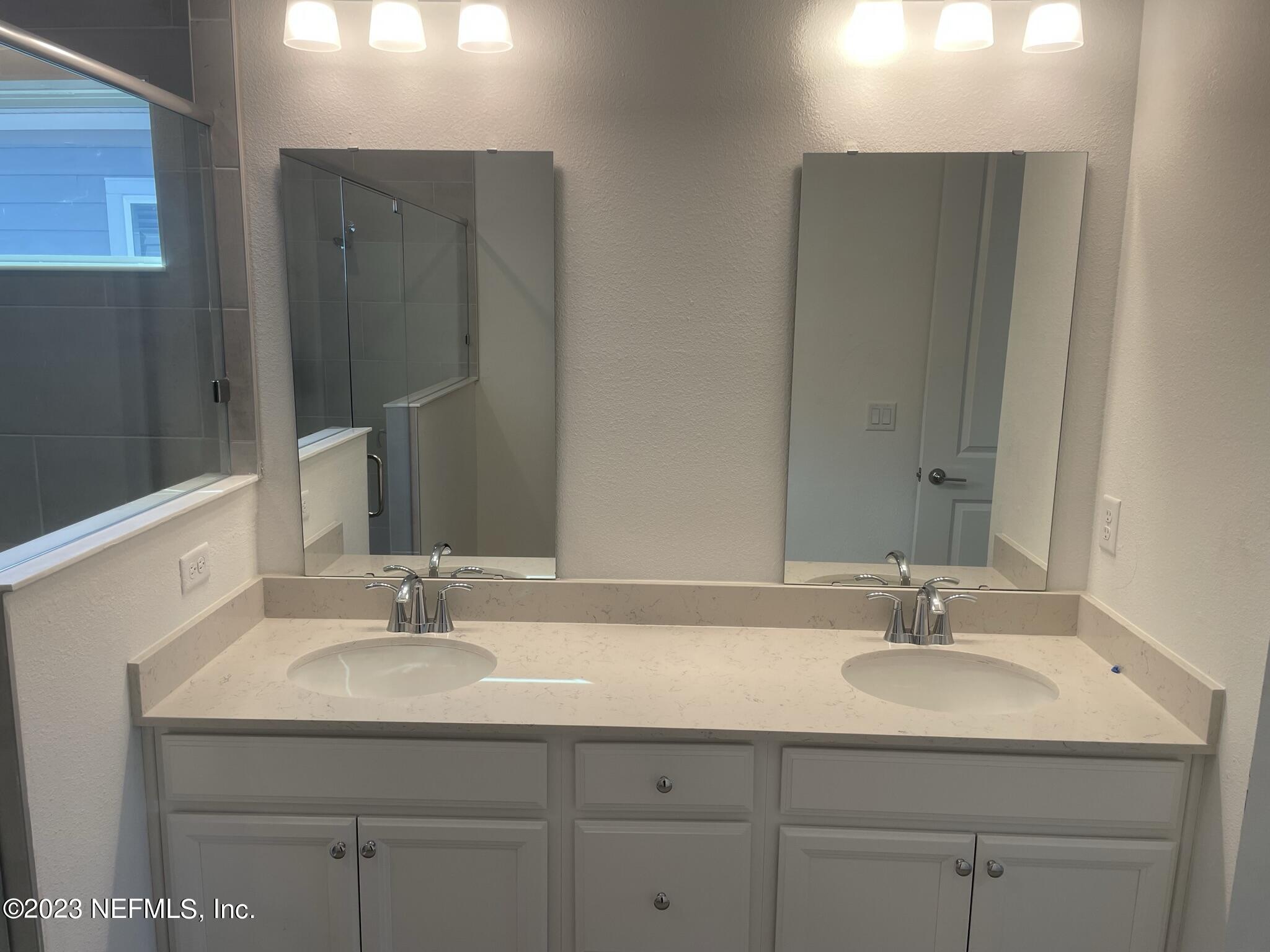 35 Hammer Circle St. Johns, FL 32259 - Photo 14 of 22 a bathroom with a sink and a mirror