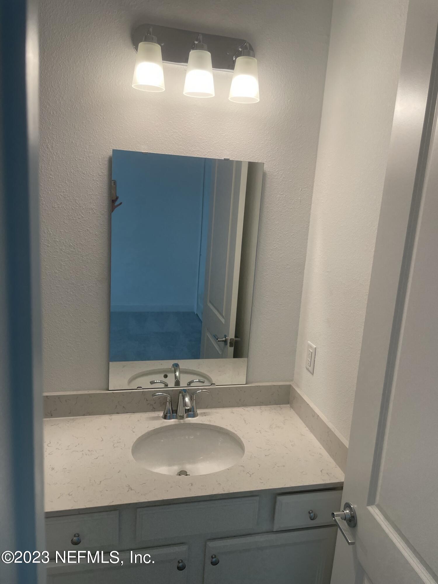 35 Hammer Circle St. Johns, FL 32259 - Photo 17 of 22 a bathroom with a sink and a mirror