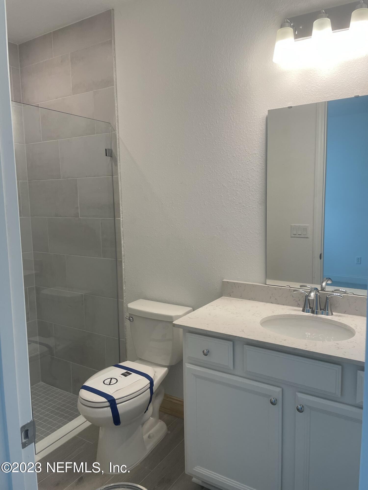 35 Hammer Circle St. Johns, FL 32259 - Photo 18 of 22 a bathroom with a sink a toilet and shower