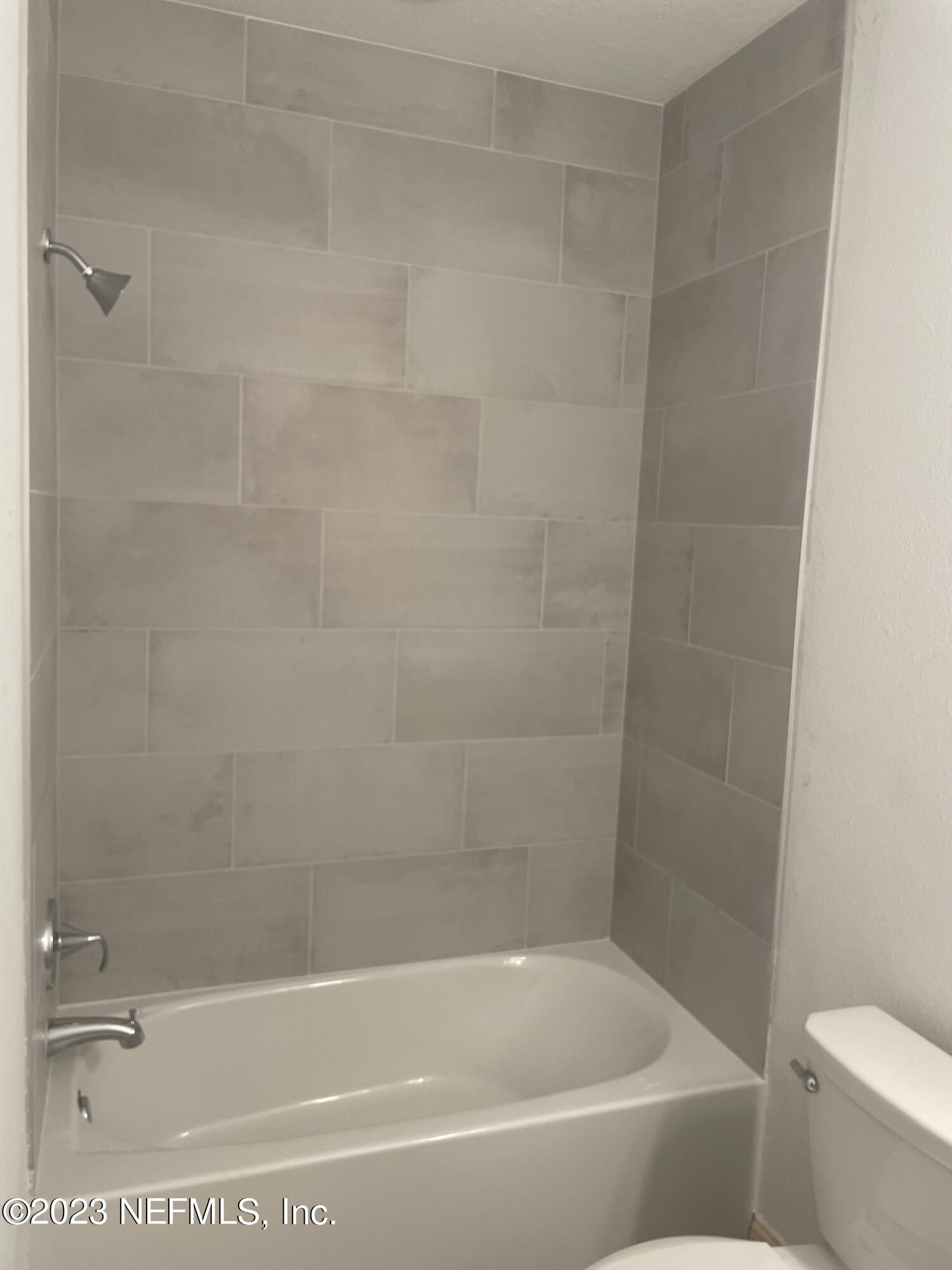 35 Hammer Circle St. Johns, FL 32259 - Photo 20 of 22 a bath tub sitting next to a white toilet and sink