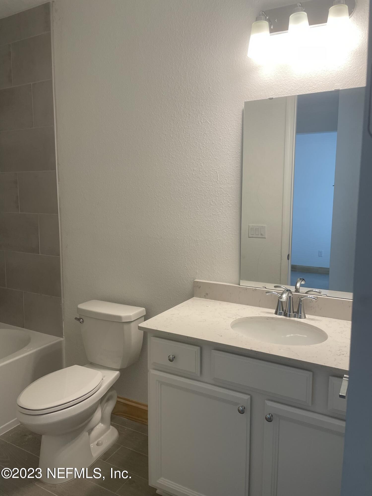 35 Hammer Circle St. Johns, FL 32259 - Photo 21 of 22 a bathroom with a toilet a sink and mirror