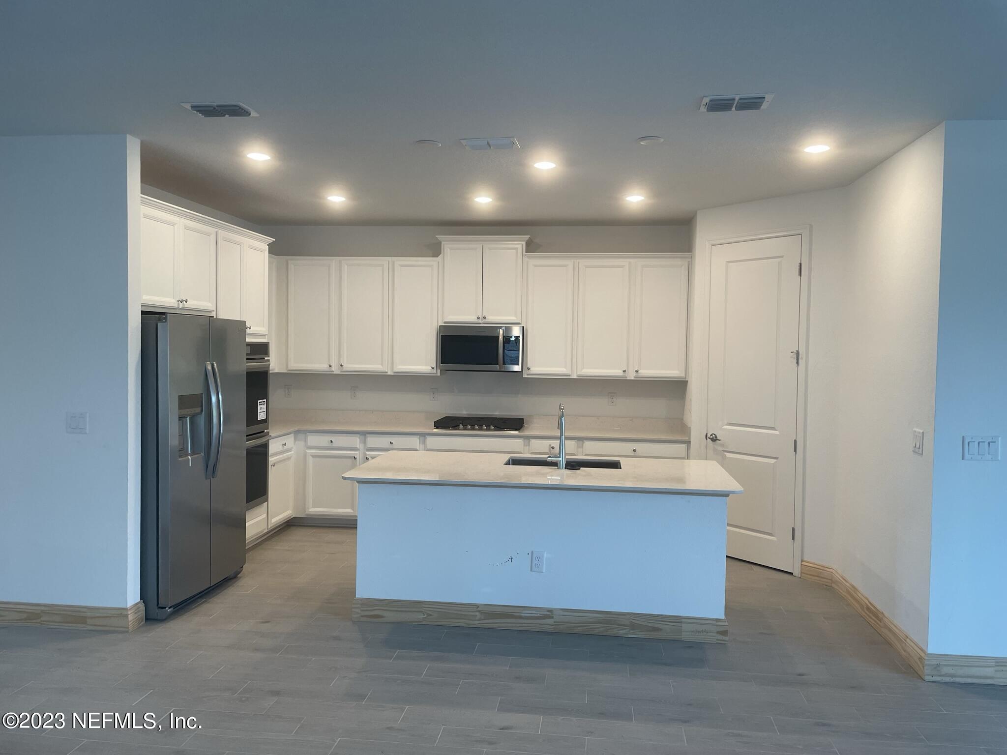 35 Hammer Circle St. Johns, FL 32259 - Photo 3 of 22 a kitchen with stainless steel appliances granite countertop a sink a refrigerator and a stove