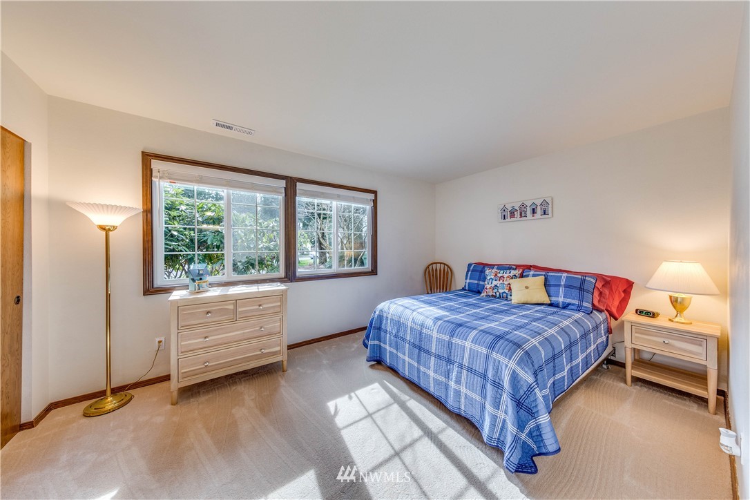 3121 166th Place Southeast Bothell, WA 98012 - Photo 12 of 28 a bedroom with a bed and a window