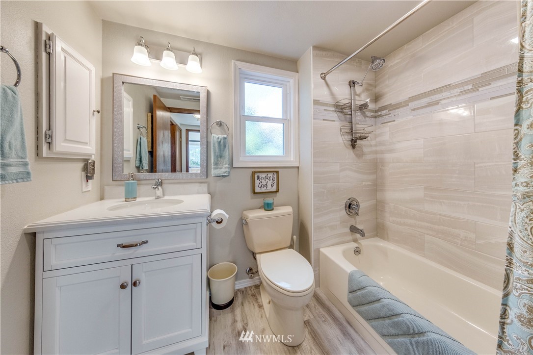 3121 166th Place Southeast Bothell, WA 98012 - Photo 14 of 28 a bathroom with a sink a toilet and shower