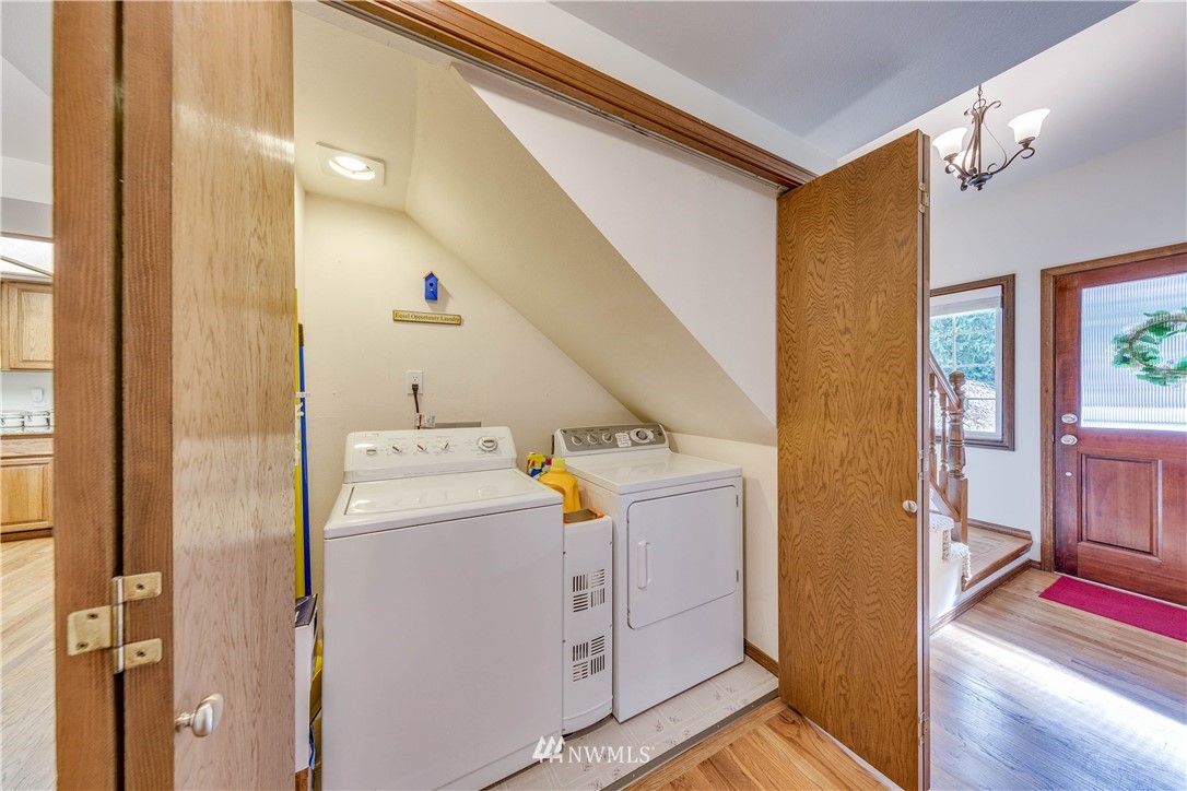 3121 166th Place Southeast Bothell, WA 98012 - Photo 15 of 28 a view of a hallway with washer and dryer