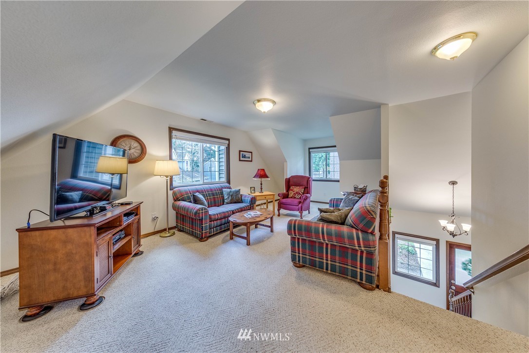 3121 166th Place Southeast Bothell, WA 98012 - Photo 16 of 28 a living room with furniture and a window