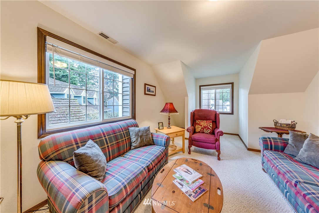 3121 166th Place Southeast Bothell, WA 98012 - Photo 17 of 28 a living room with furniture and a large window