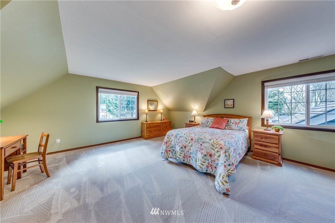 3121 166th Place Southeast Bothell, WA 98012 - Photo 19 of 28 a bedroom with a bed and a window