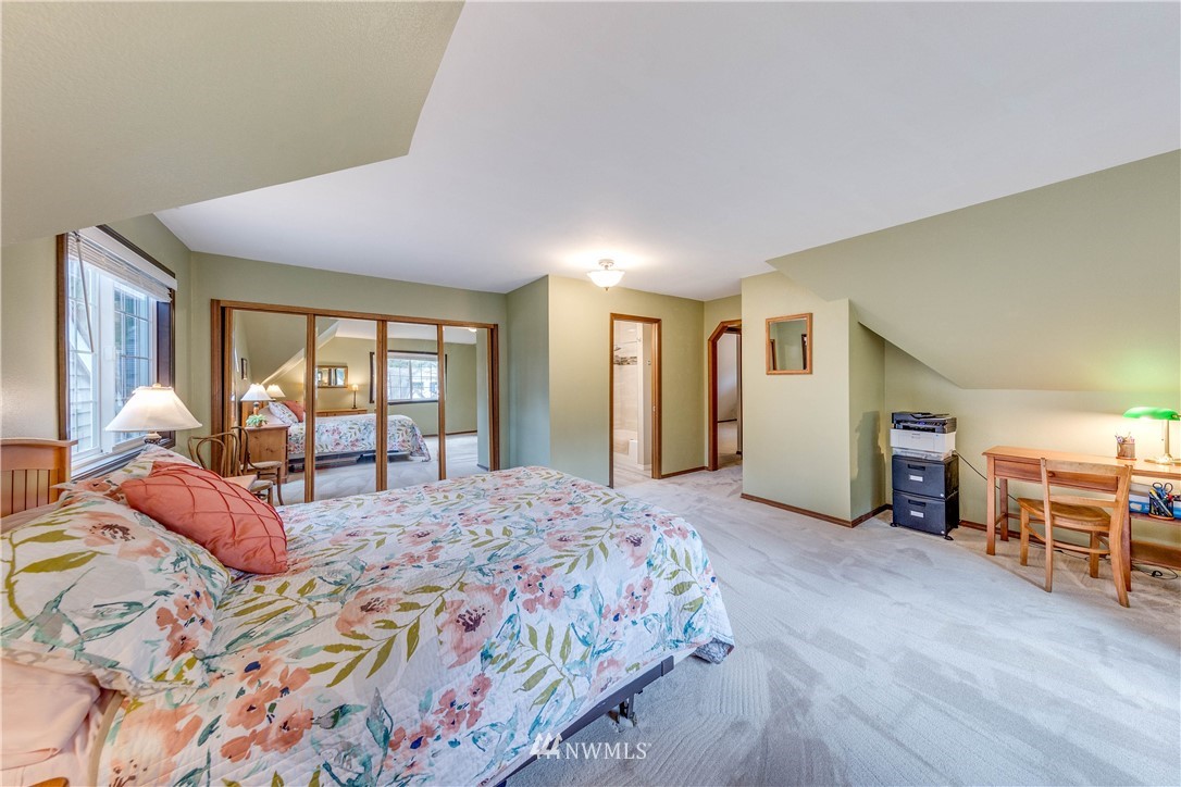 3121 166th Place Southeast Bothell, WA 98012 - Photo 21 of 28 a bedroom with a large bed and windows