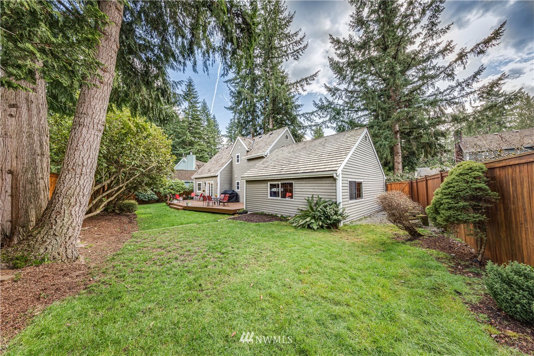3121 166th Place Southeast Bothell, WA 98012 - Photo 23 of 28 a view of a house with a yard and plants