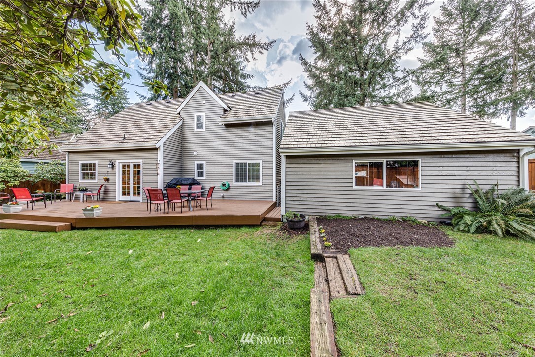 3121 166th Place Southeast Bothell, WA 98012 - Photo 24 of 28 a group of people sitting in front of a house