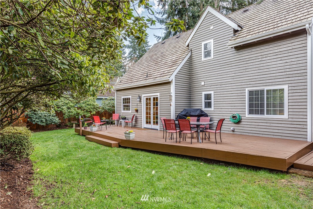 3121 166th Place Southeast Bothell, WA 98012 - Photo 25 of 28 a view of a house with a backyard and chairs