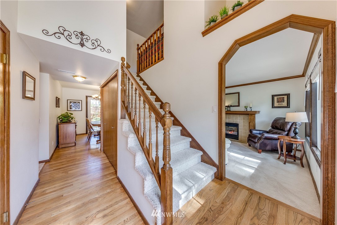 3121 166th Place Southeast Bothell, WA 98012 - Photo 4 of 28 a view of entryway and hall with wooden floor