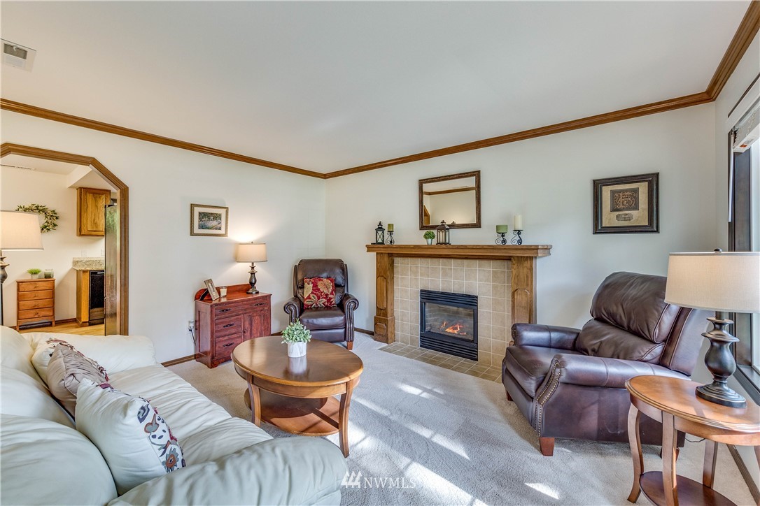 3121 166th Place Southeast Bothell, WA 98012 - Photo 5 of 28 a living room with furniture and a fireplace