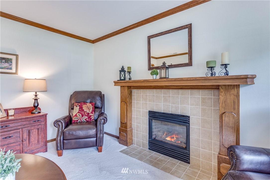3121 166th Place Southeast Bothell, WA 98012 - Photo 6 of 28 a living room with furniture and a fireplace