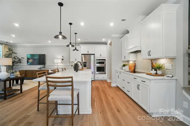 a large kitchen with lots of counter space and windows