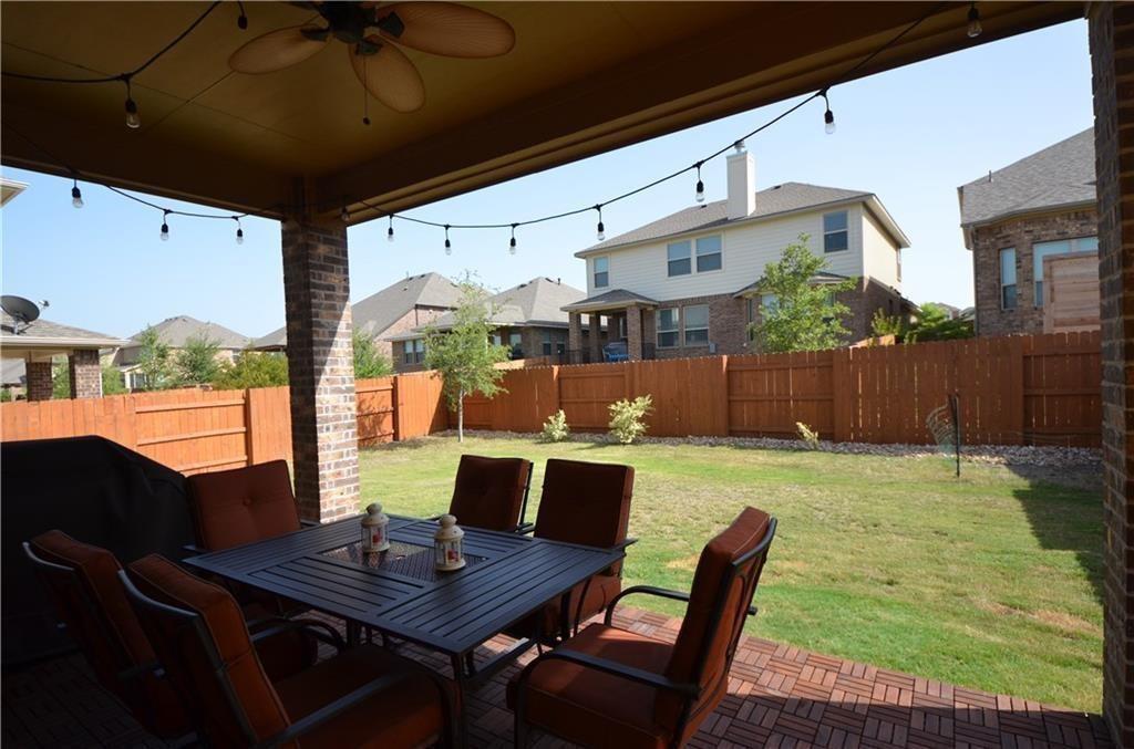 5629 Rio Chama Cove Austin, TX 78738 - Photo 22 of 34 A private backyard oasis with a covered patio, perfect for outdoor dining and entertaining.