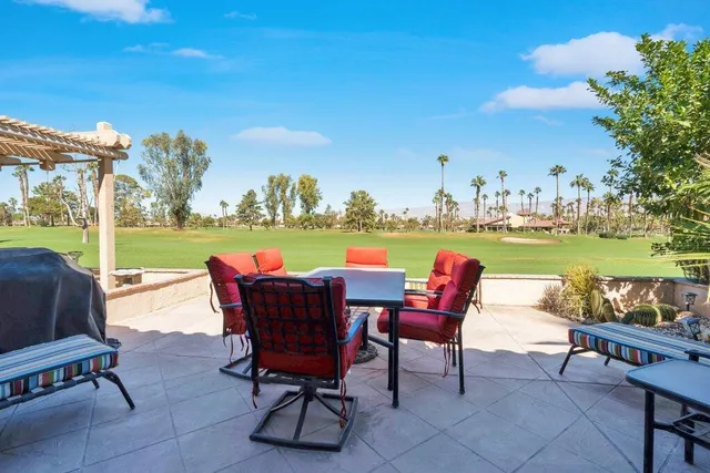 a view of a chairs and table in the patio