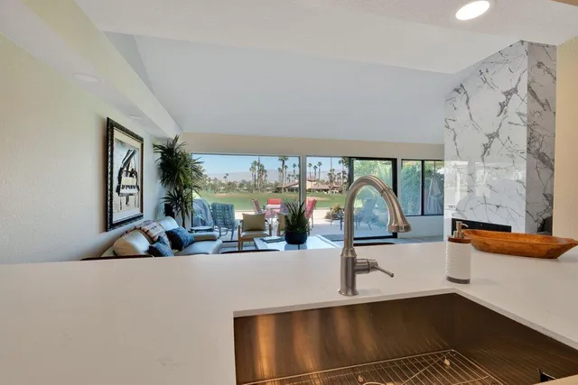a view of a living room and chandelier
