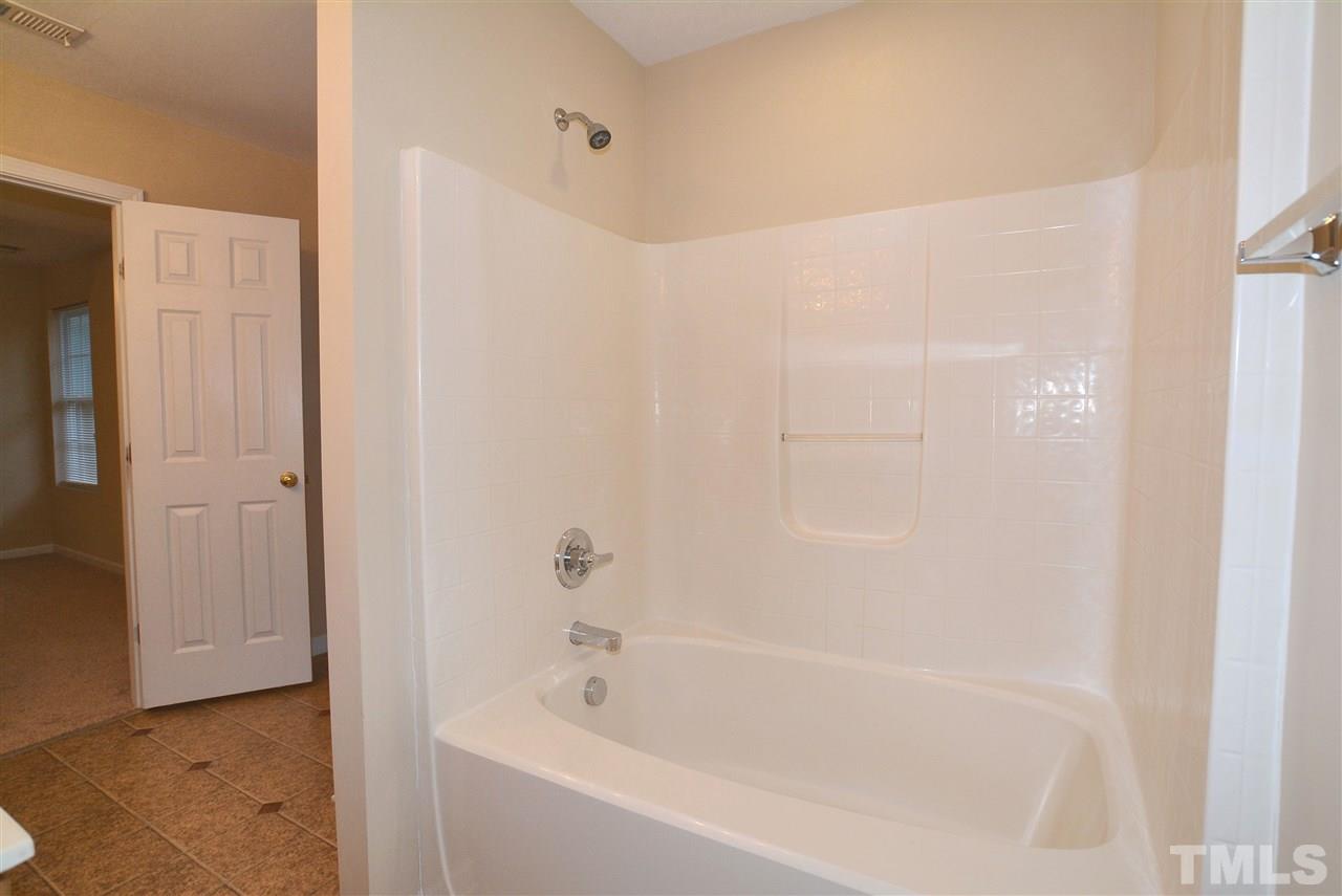 4604 Marathon Lane Raleigh, NC 27616 - Photo 17 of 25 a bathroom with a bathtub