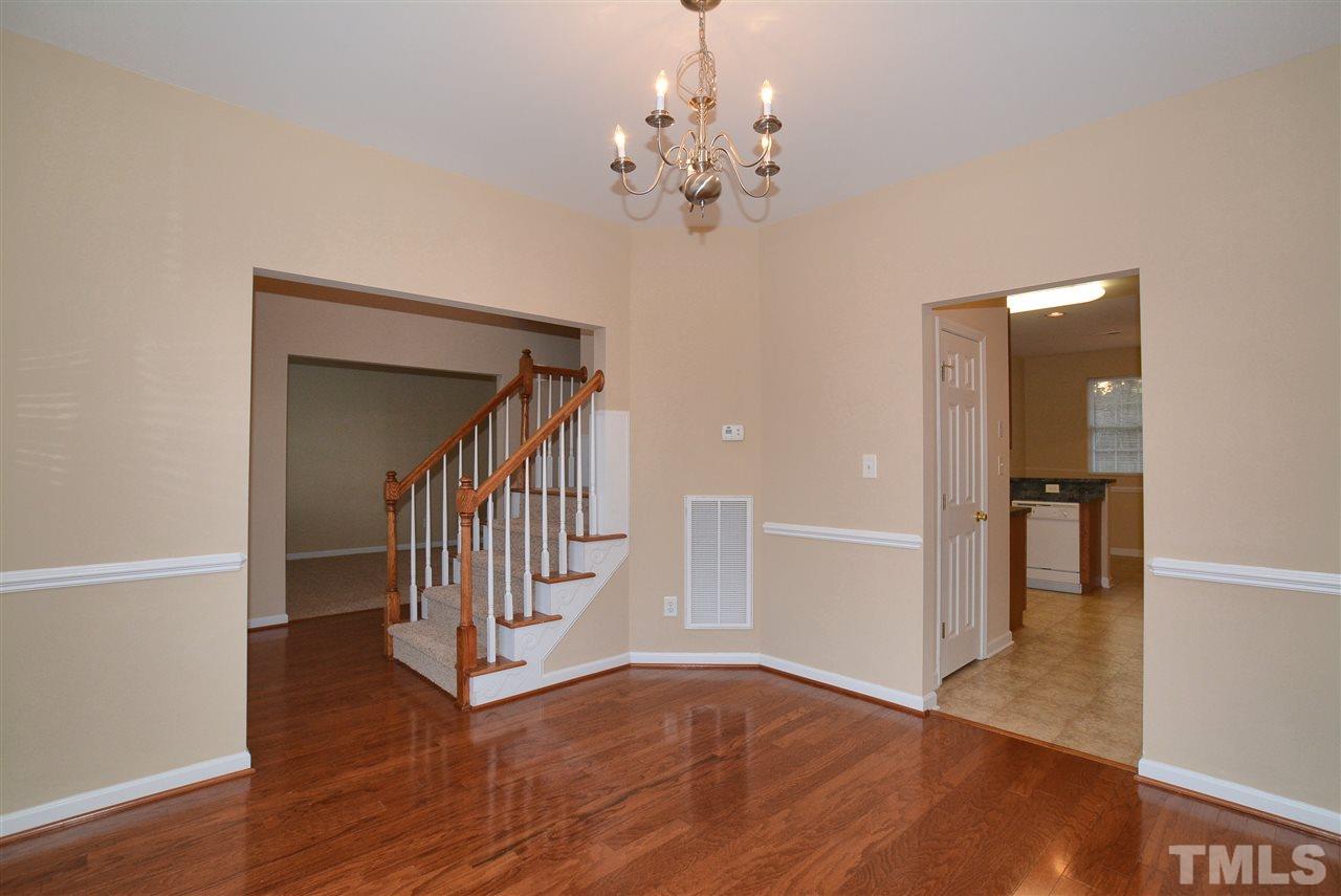 4604 Marathon Lane Raleigh, NC 27616 - Photo 7 of 25 a view of a hallway with wooden floor and staircase
