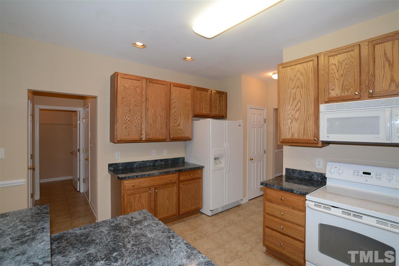 4604 Marathon Lane Raleigh, NC 27616 - Photo 8 of 25 a kitchen with a refrigerator sink and cabinets