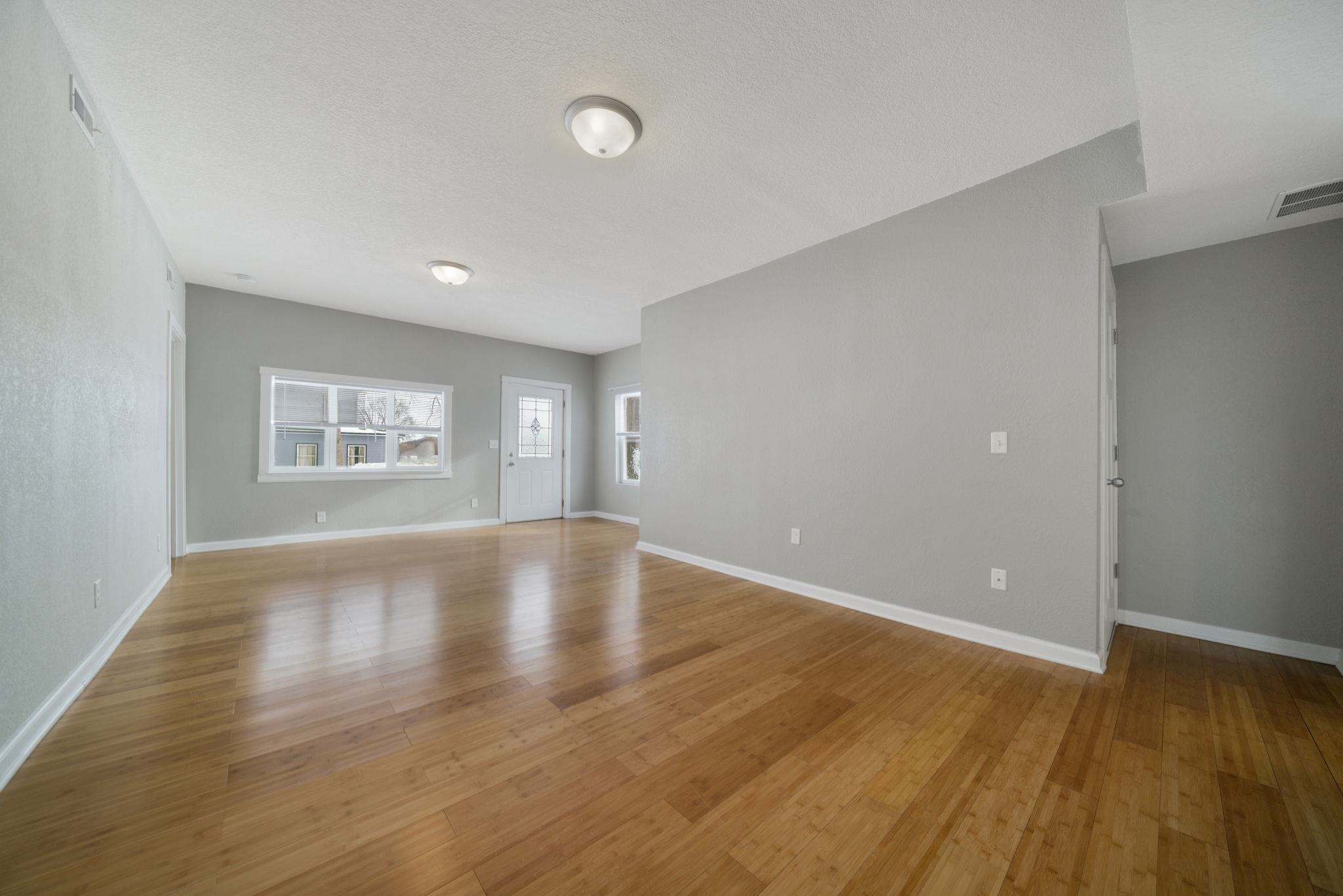 1104 South 4th Street Oregon, IL 61061 - Photo 11 of 36 wooden floor in an empty room with a window