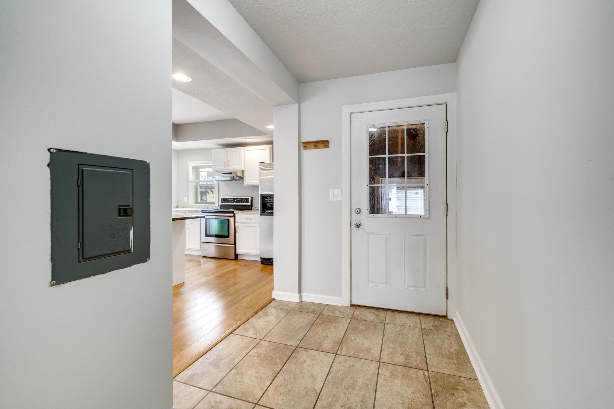 1104 South 4th Street Oregon, IL 61061 - Photo 16 of 36 a view of a kitchen with refrigerator and wooden floor
