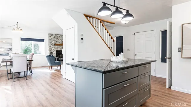 a view of living room with granite countertop furniture and fireplace