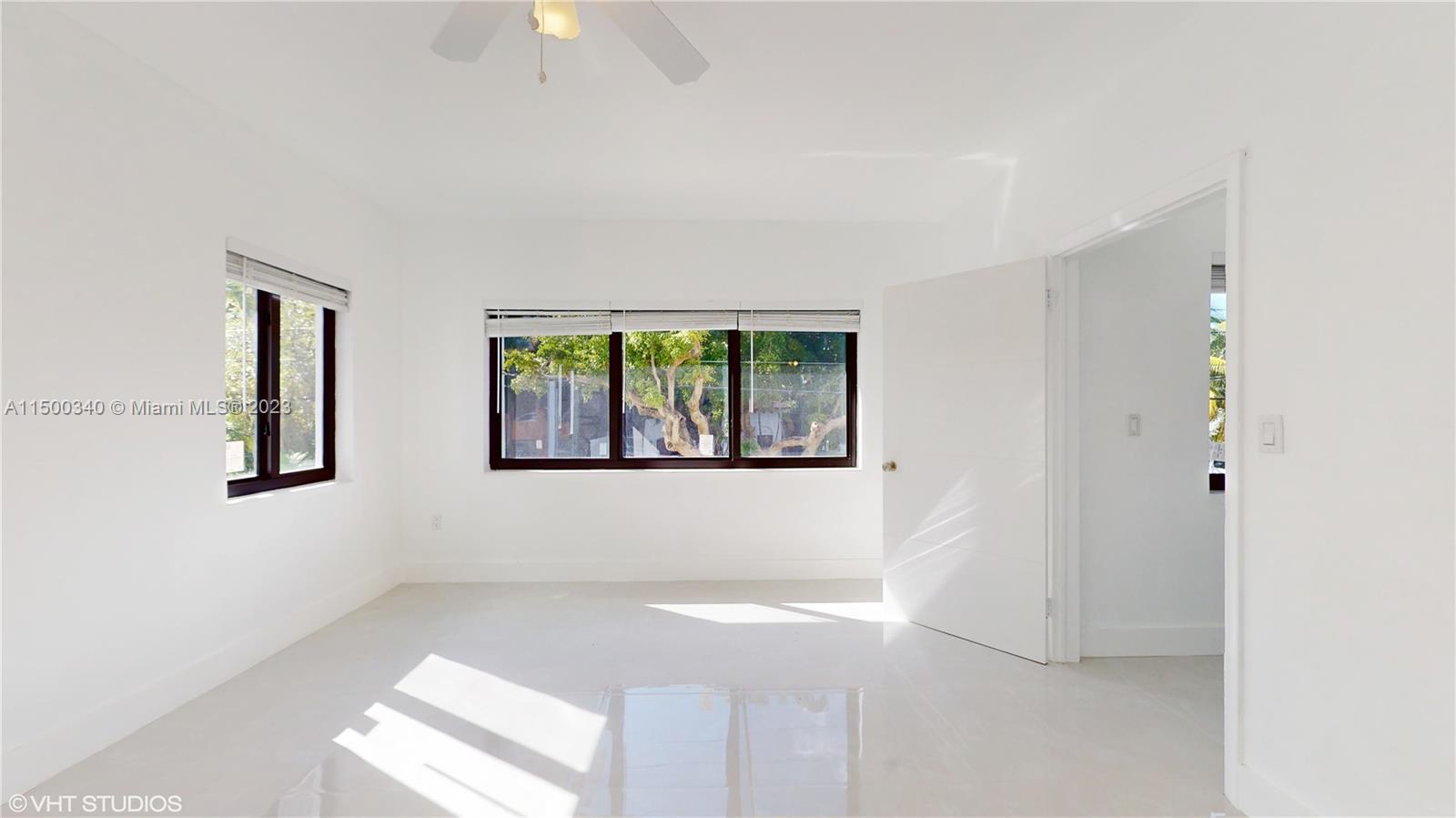 325 Southwest 30th Road, Unit L Miami, FL 33129 - Photo 12 of 25 a view of an empty room with a window