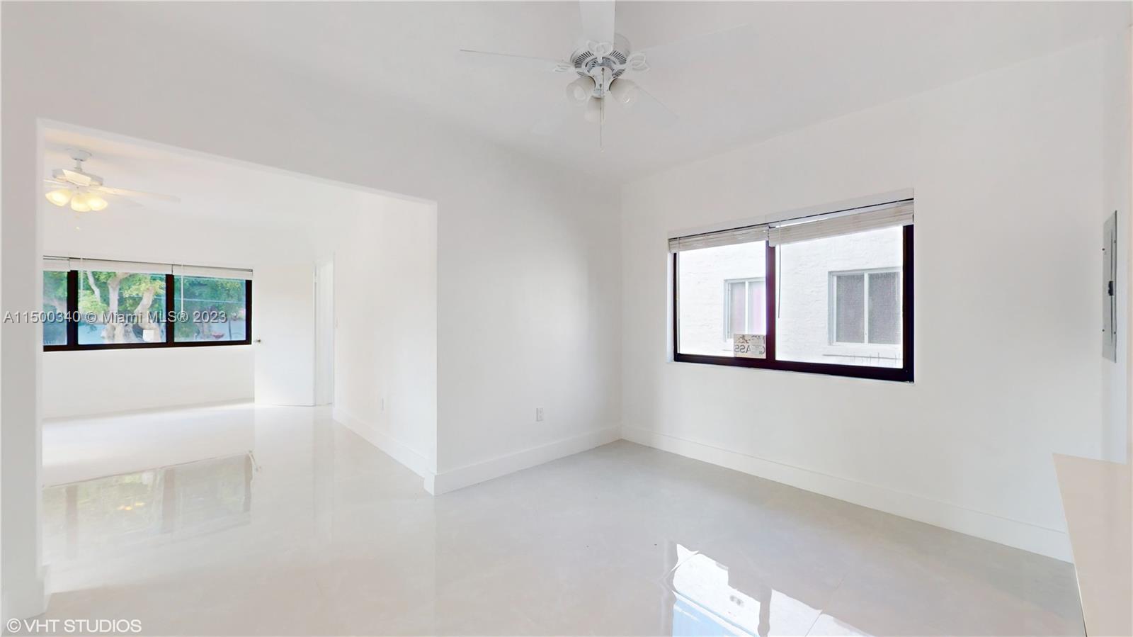 325 Southwest 30th Road, Unit L Miami, FL 33129 - Photo 13 of 25 a view of an empty room with a window