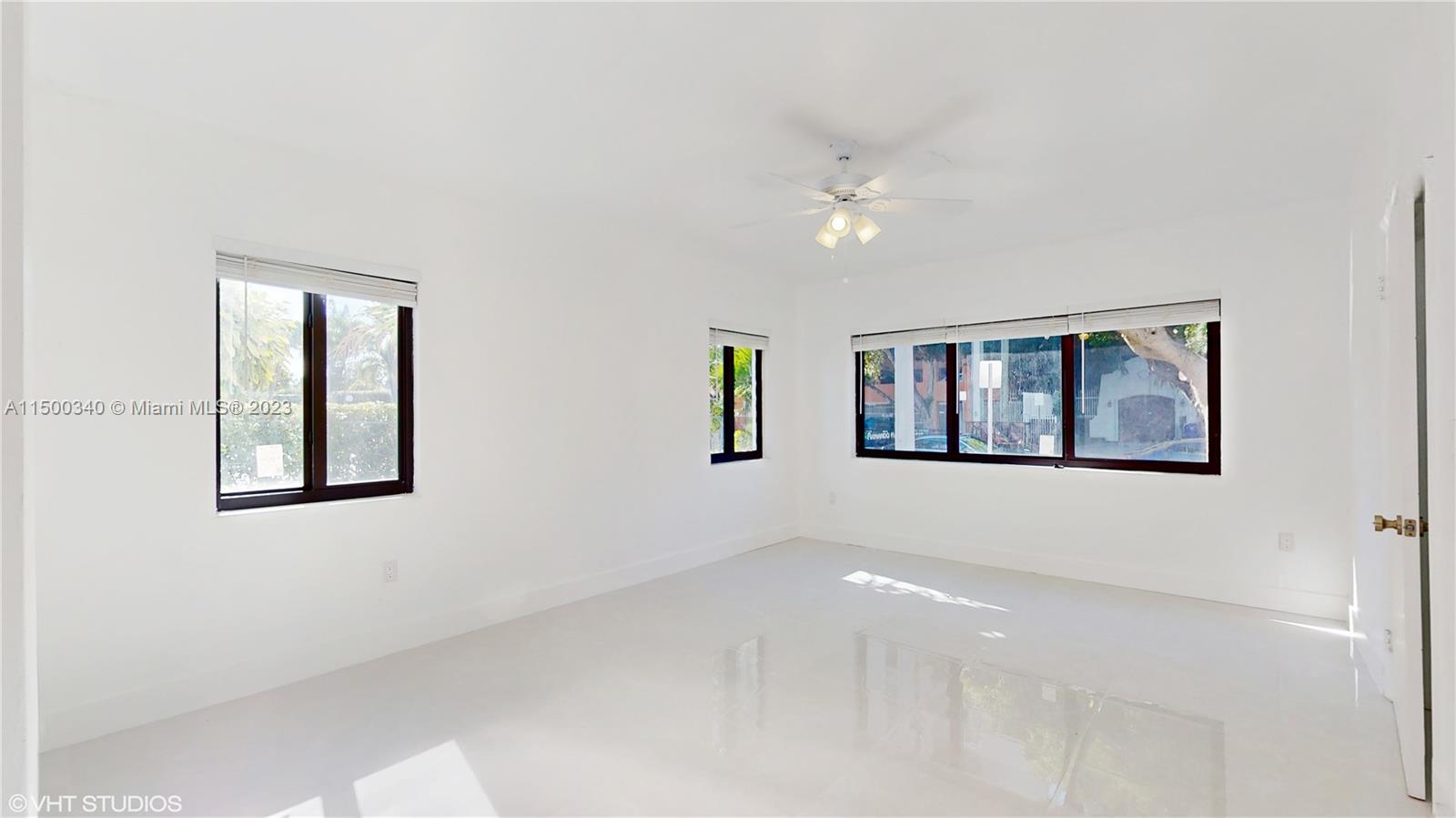 325 Southwest 30th Road, Unit L Miami, FL 33129 - Photo 14 of 25 a view of an empty room with windows