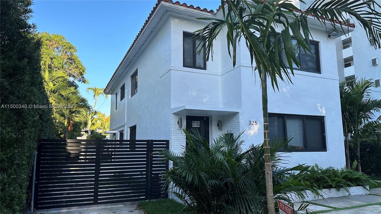 325 Southwest 30th Road, Unit L Miami, FL 33129 - Photo 21 of 25 a view of a house with a tree