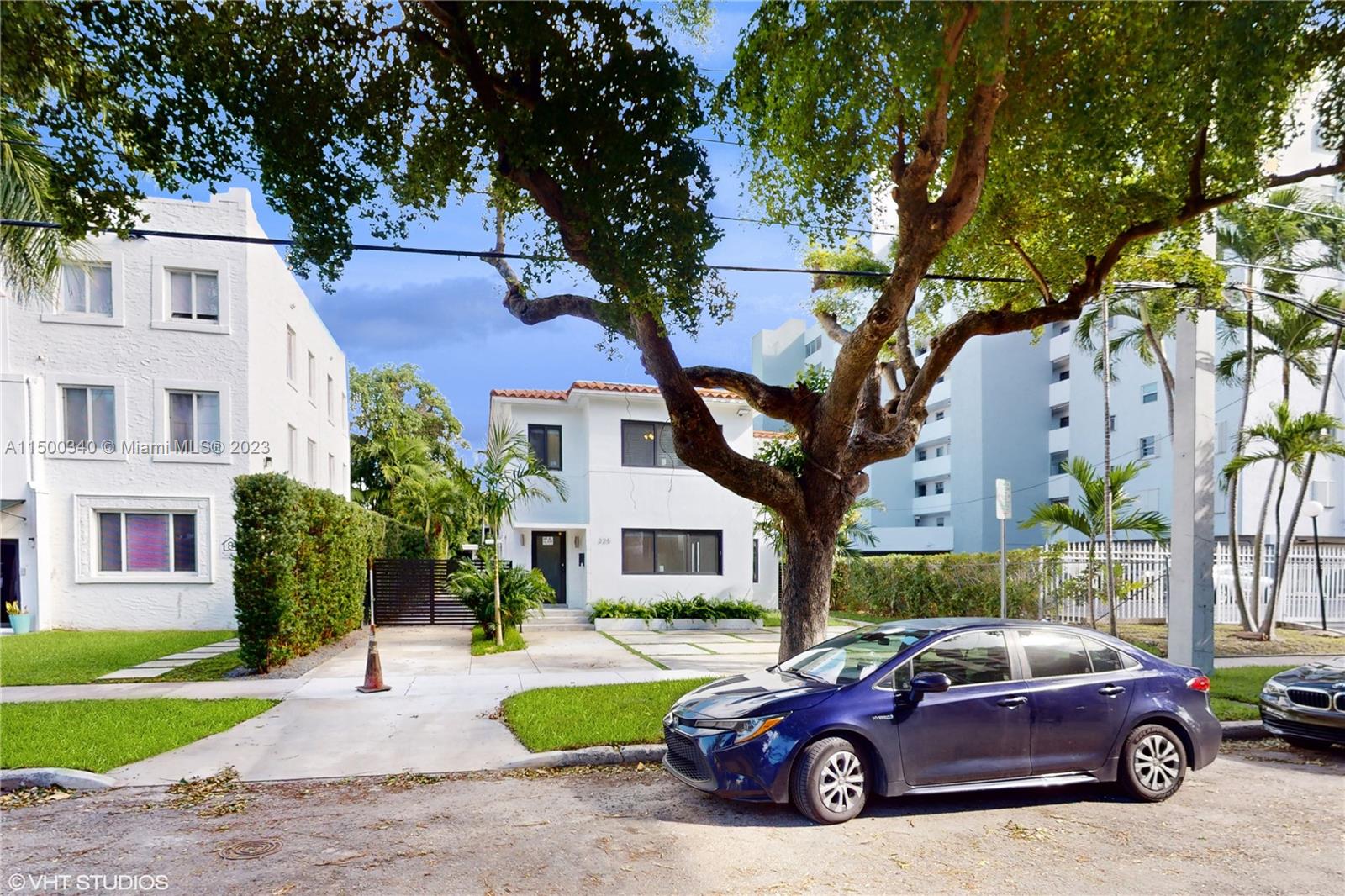 325 Southwest 30th Road, Unit L Miami, FL 33129 - Photo 3 of 25 a car parked in front of a house