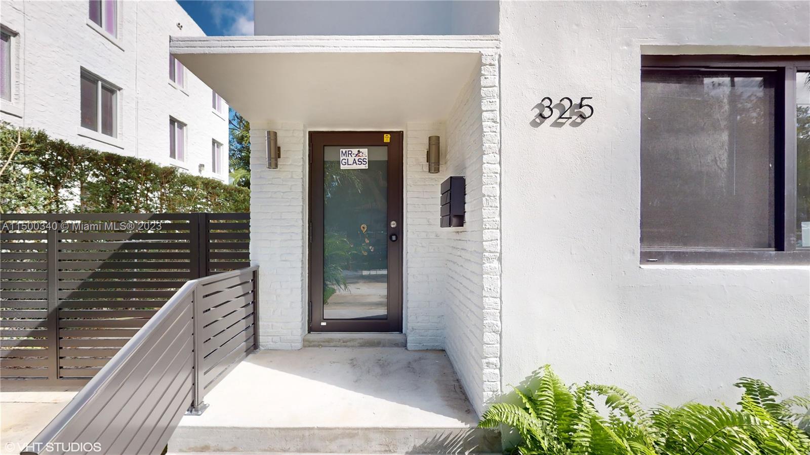 325 Southwest 30th Road, Unit L Miami, FL 33129 - Photo 4 of 25 a view of a wooden door and a street