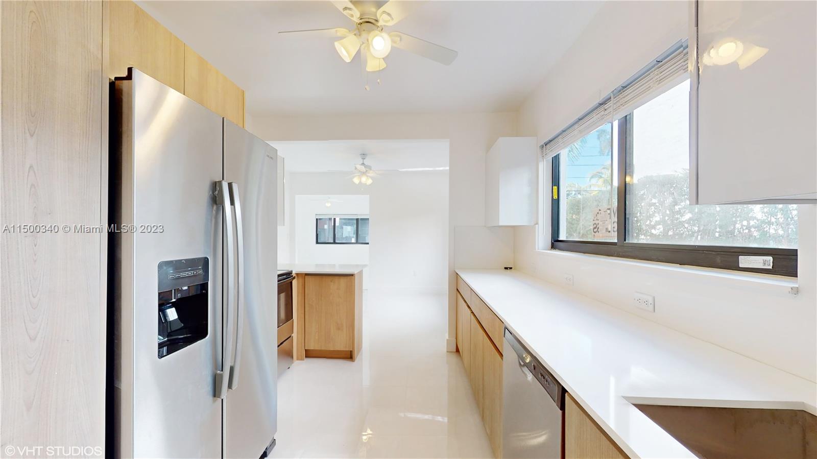 325 Southwest 30th Road, Unit L Miami, FL 33129 - Photo 7 of 25 a bathroom with a tub sink and mirror
