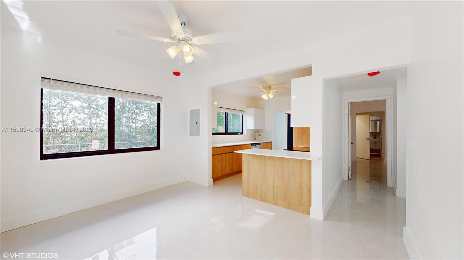 325 Southwest 30th Road, Unit L Miami, FL 33129 - Photo 8 of 25 a view of kitchen with refrigerator and window