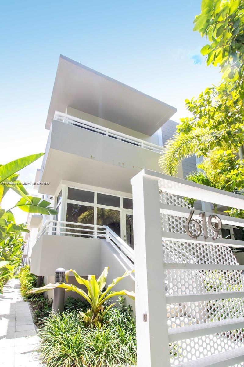 619 Meridian Avenue, Unit 5 Miami Beach, FL 33139 - Photo 1 of 27 a view of a swimming pool with a yard