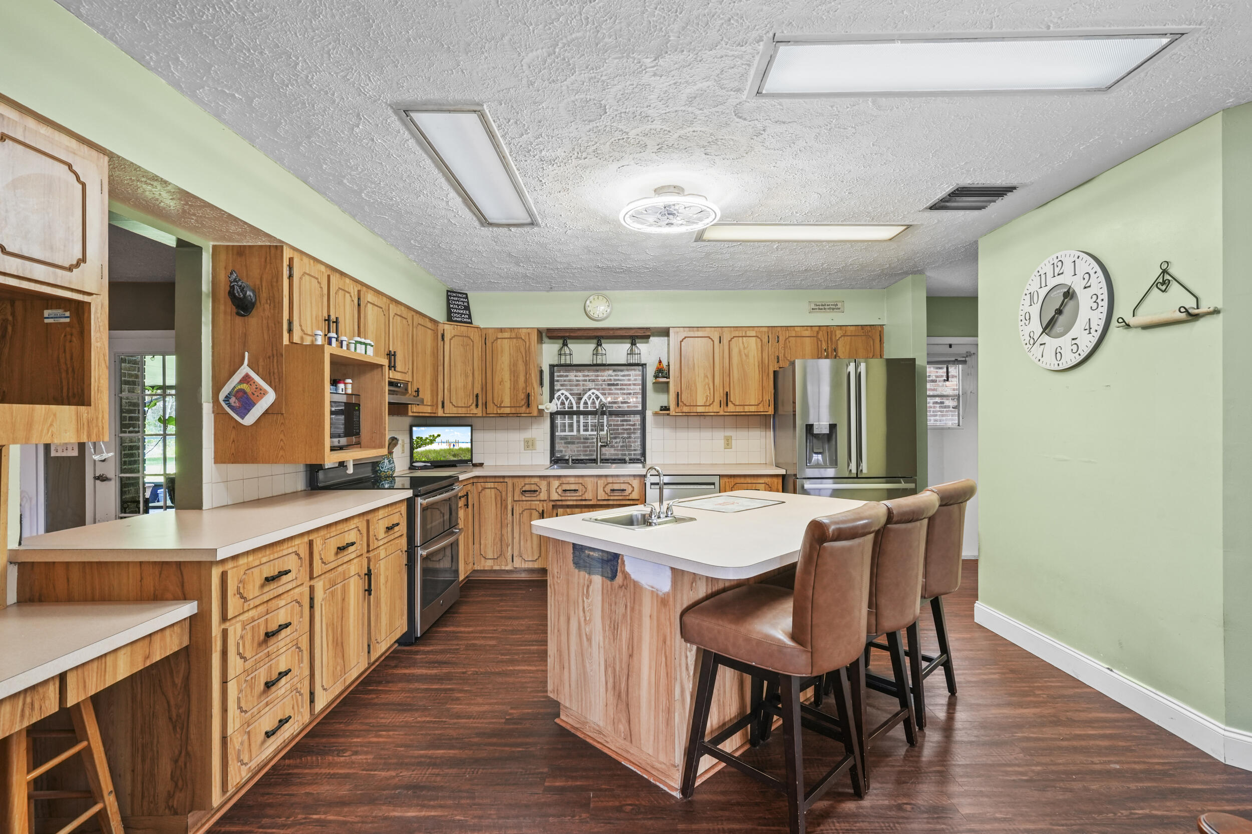 4170 McCarty Road Fort Pierce, FL 34945 - Photo 11 of 57 a large kitchen with a table and chairs