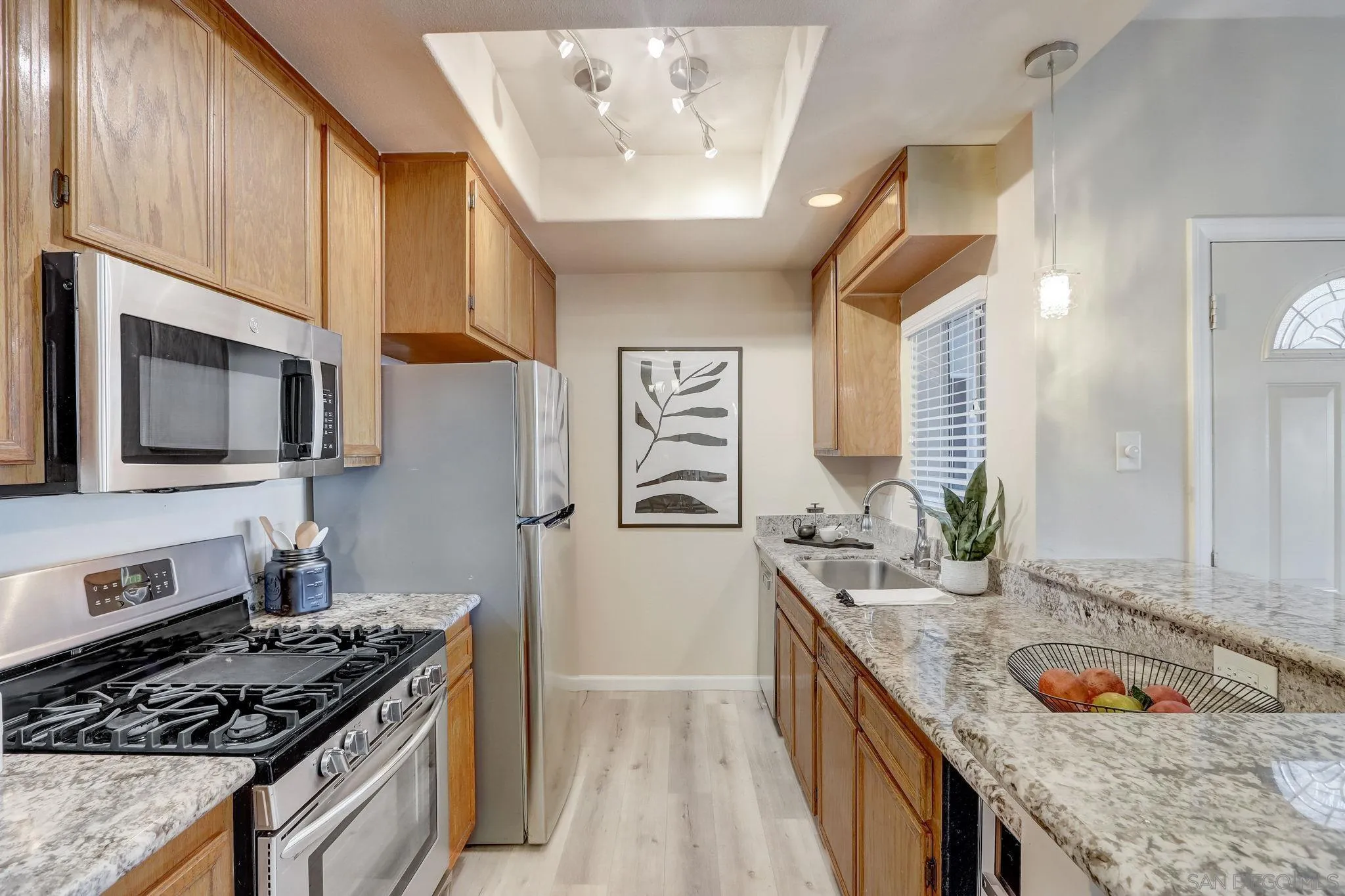 13832 Midland Road Poway, CA 92064 - Photo 13 of 36 a kitchen with stainless steel appliances granite countertop a sink stove and cabinets