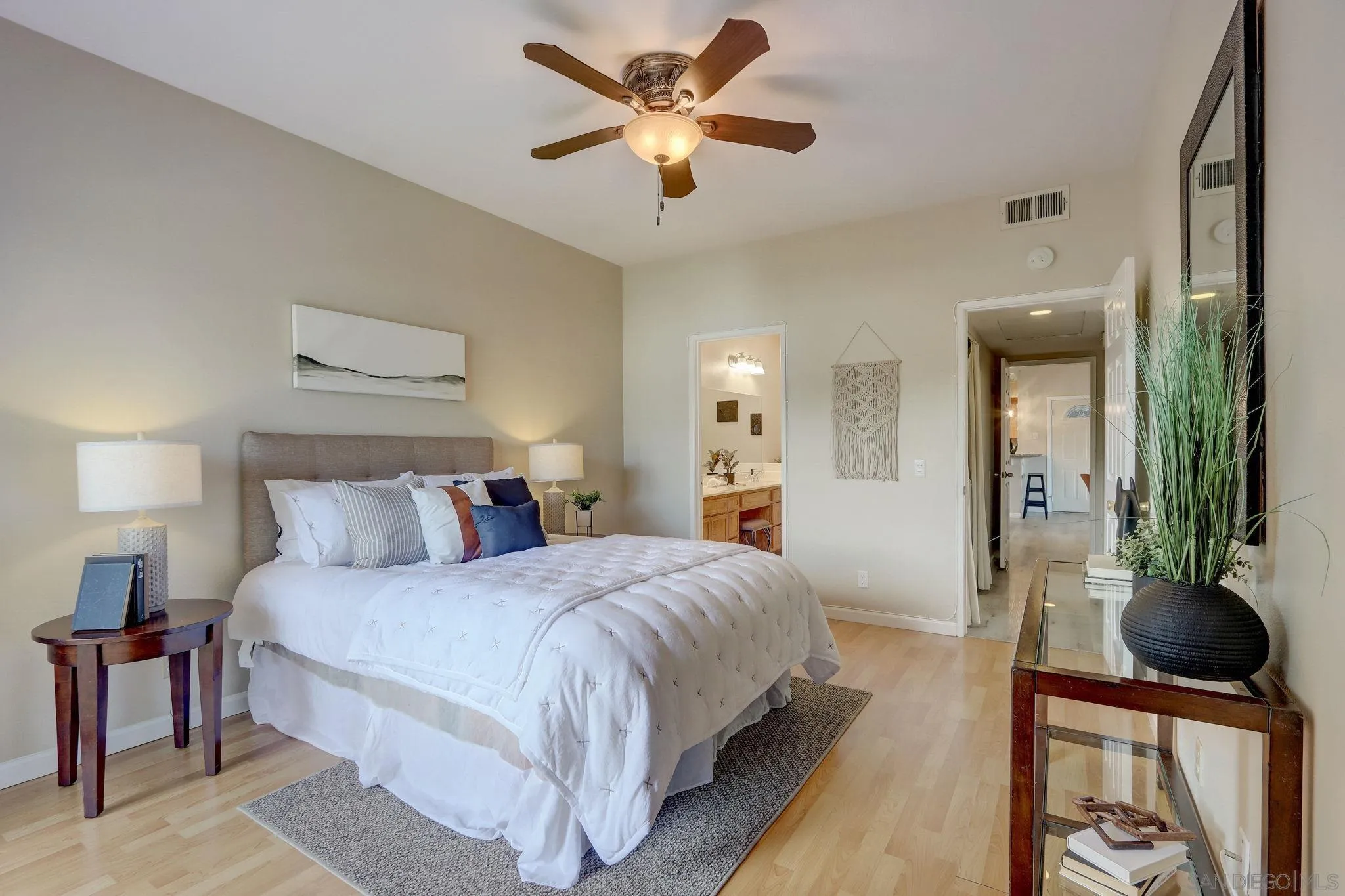 13832 Midland Road Poway, CA 92064 - Photo 17 of 36 a bedroom with a bed and a chandelier