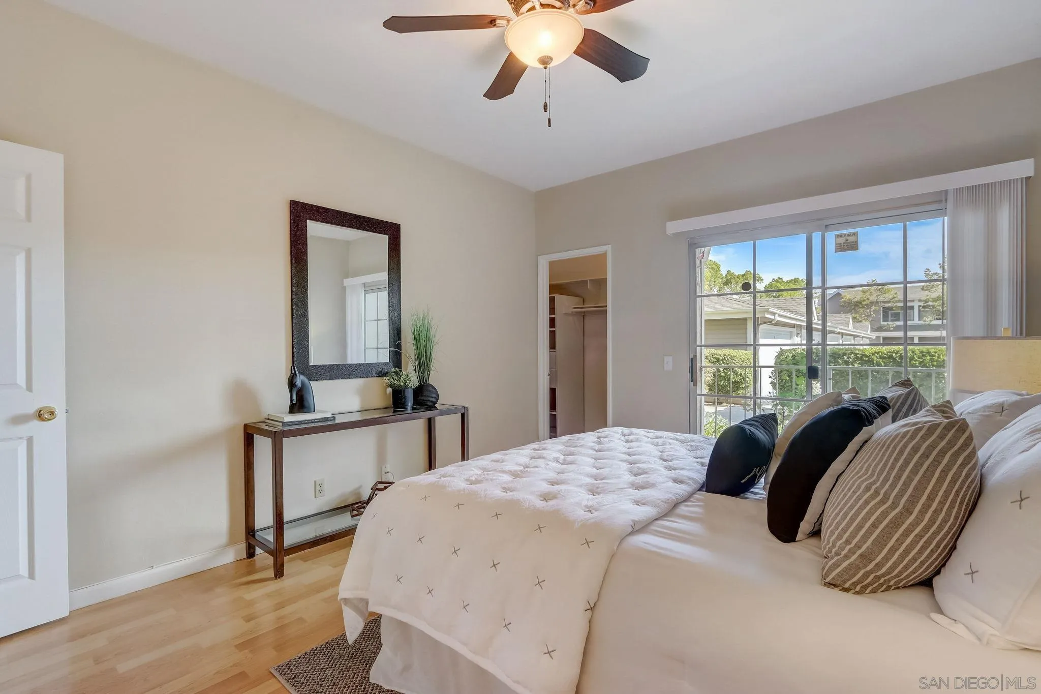 13832 Midland Road Poway, CA 92064 - Photo 19 of 36 a bedroom with a bed lamps and window