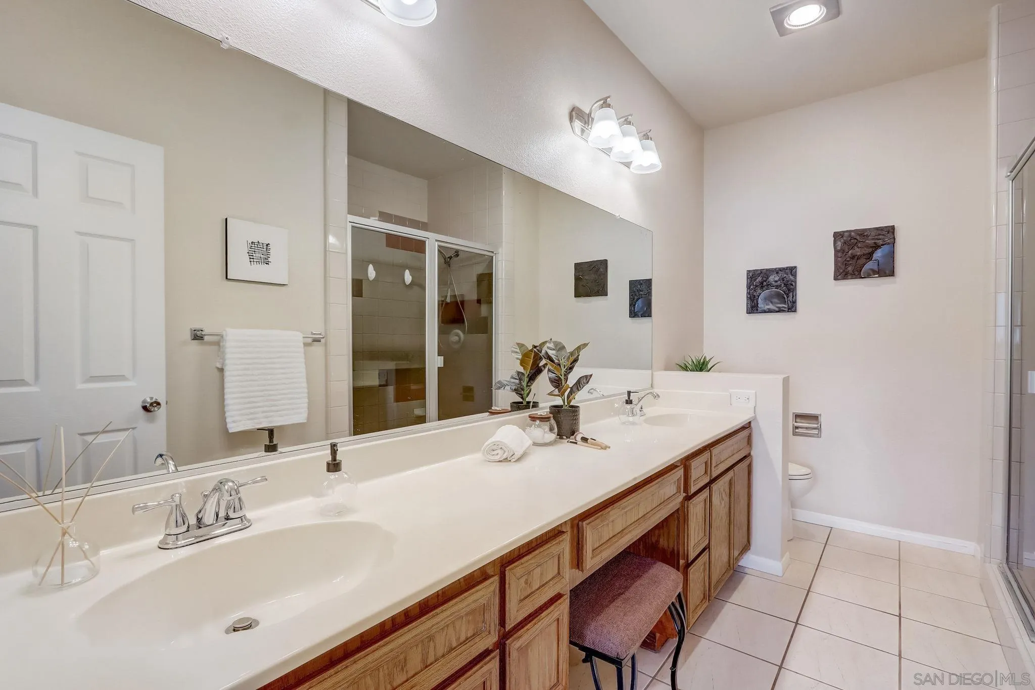 13832 Midland Road Poway, CA 92064 - Photo 20 of 36 a bathroom with a sink double vanity and a mirror